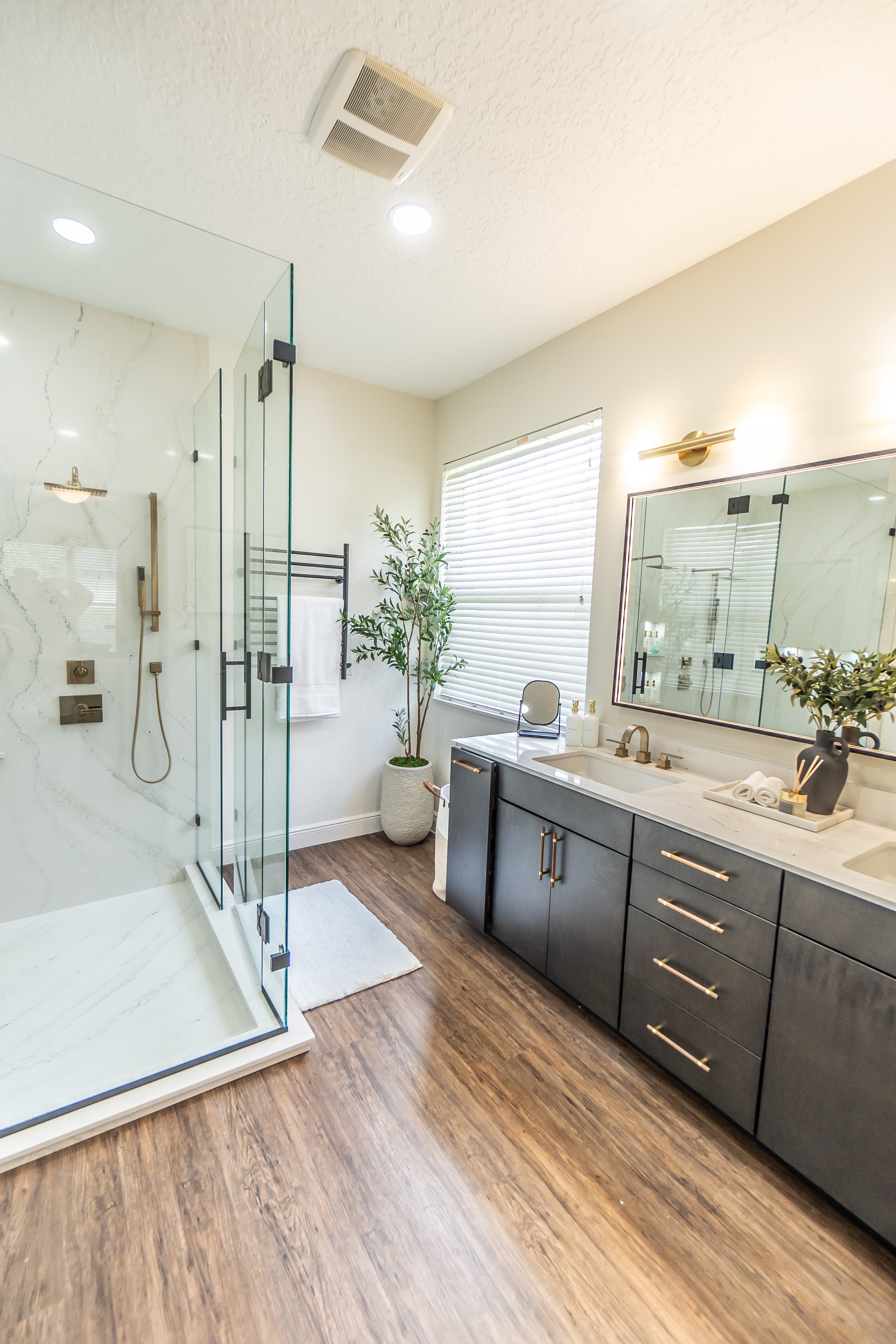 Modern bathroom remodel with walk-in shower and double vanity in a Des Moines Iowa home